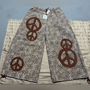 DAVI & DANI Leopard Print Wide Leg Pants with Brown Peace Symbols